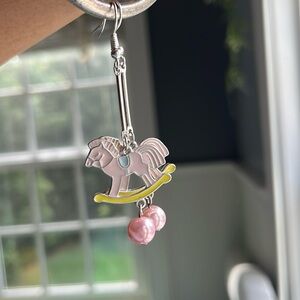 Women’s pink rocking horse dangle earrings